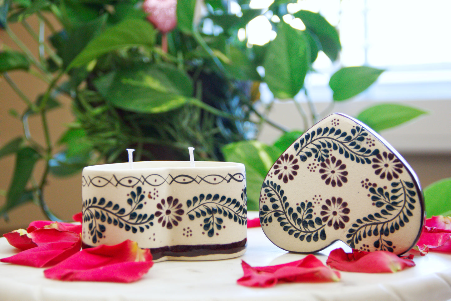 Artisanal candle in a beautiful heart shaped talavera. Handmade brown floral design with a lid on the side. Handcrafted by Artisan in Mexico City. 100% All Natural Soy Candle. Reuse the talavera as home decor or storage.