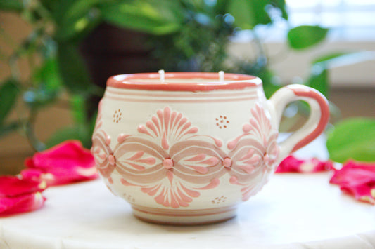 Artisanal candle in a beautiful light pink and biege handmade design talavera cup with a handle. Handcrafted by Artisan in Puebla, Mexico. 100% All Natural Soy Candle. Reuse the talavera as home decor or storage.