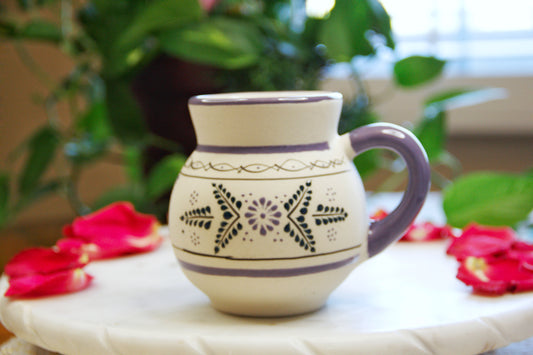 handmade artisanal candle in an indigo floral design mug with a handle. Custom made by Artisan in Mexico. 100% All Natural Soy Candle. Reuse the talavera as home decor or storage