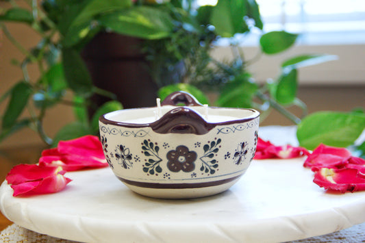 side view of an Artisanal candle in a beautiful salsa talavera bowl. Handmade indigo floral design. Handcrafted by Artisan in Mexico City. 100% All Natural Soy Candle. Reuse the talavera as home decor or storage.