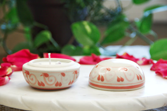 Artisanal candle in a beautiful biege and light pink talavera cup with a lid. Handmade spiral design. Handcrafted by Artisan in Mexico City. 100% All Natural Soy Candle. Reuse the talavera as home decor or storage.