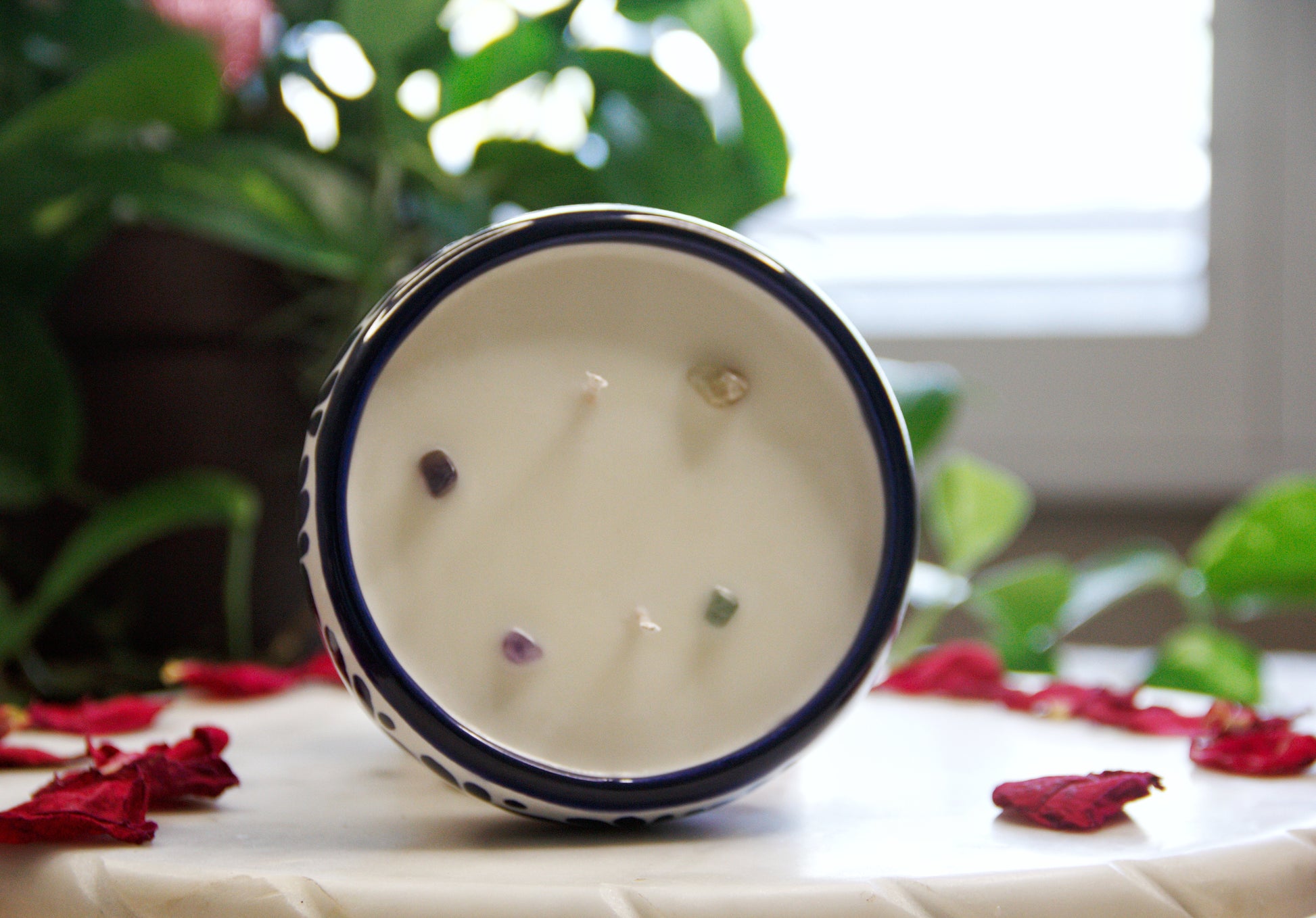 Top view of the Artisanal candle in a beautiful talavera with hand made blue strokes design. Handcrafted by Artisan in Puebla, Mexico. 100% All Natural Soy Candle. Reuse the talavera as home decor or storage.